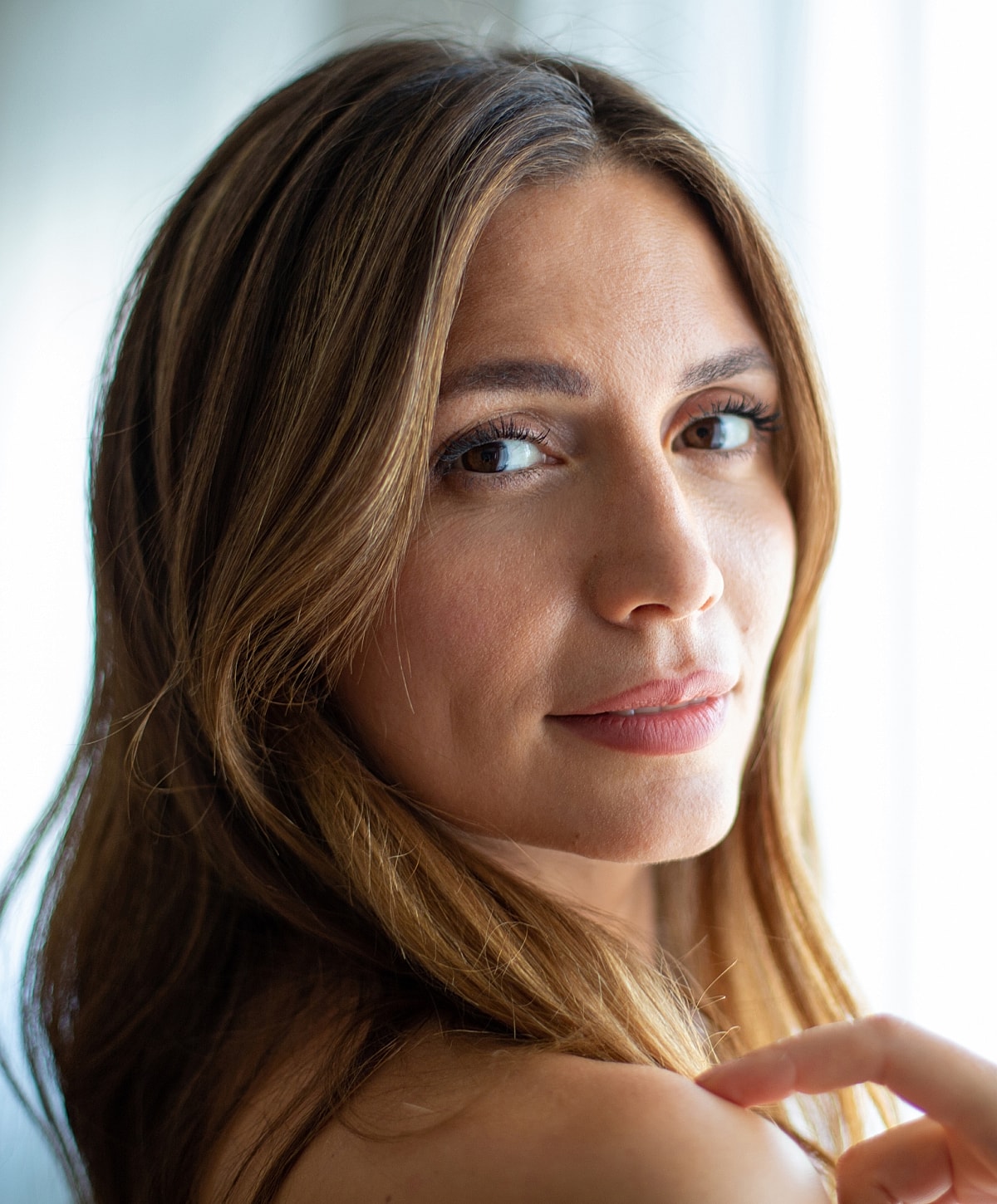 Charlotte, NC IPL Laser model with flowing brown hair