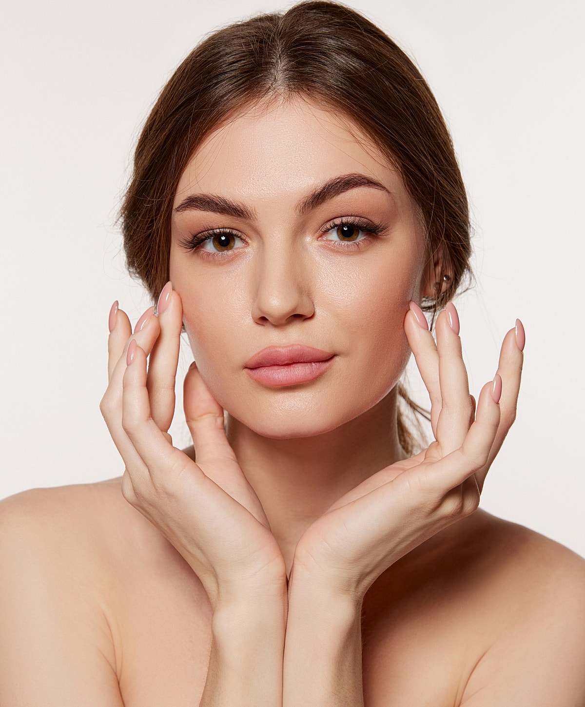 Charlotte, NC IPL Laser model showcasing skincare with hands on face.