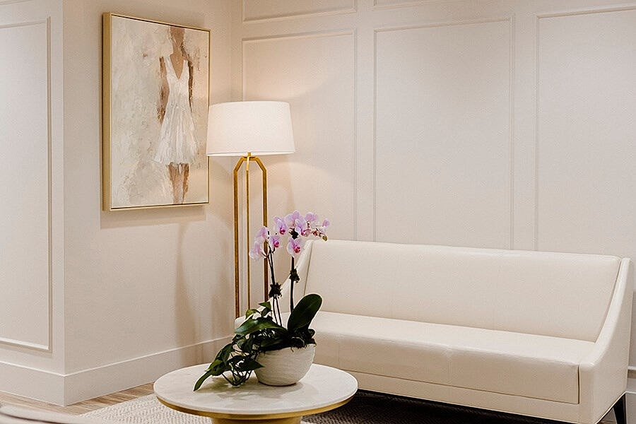 Modern living room with art and plants.