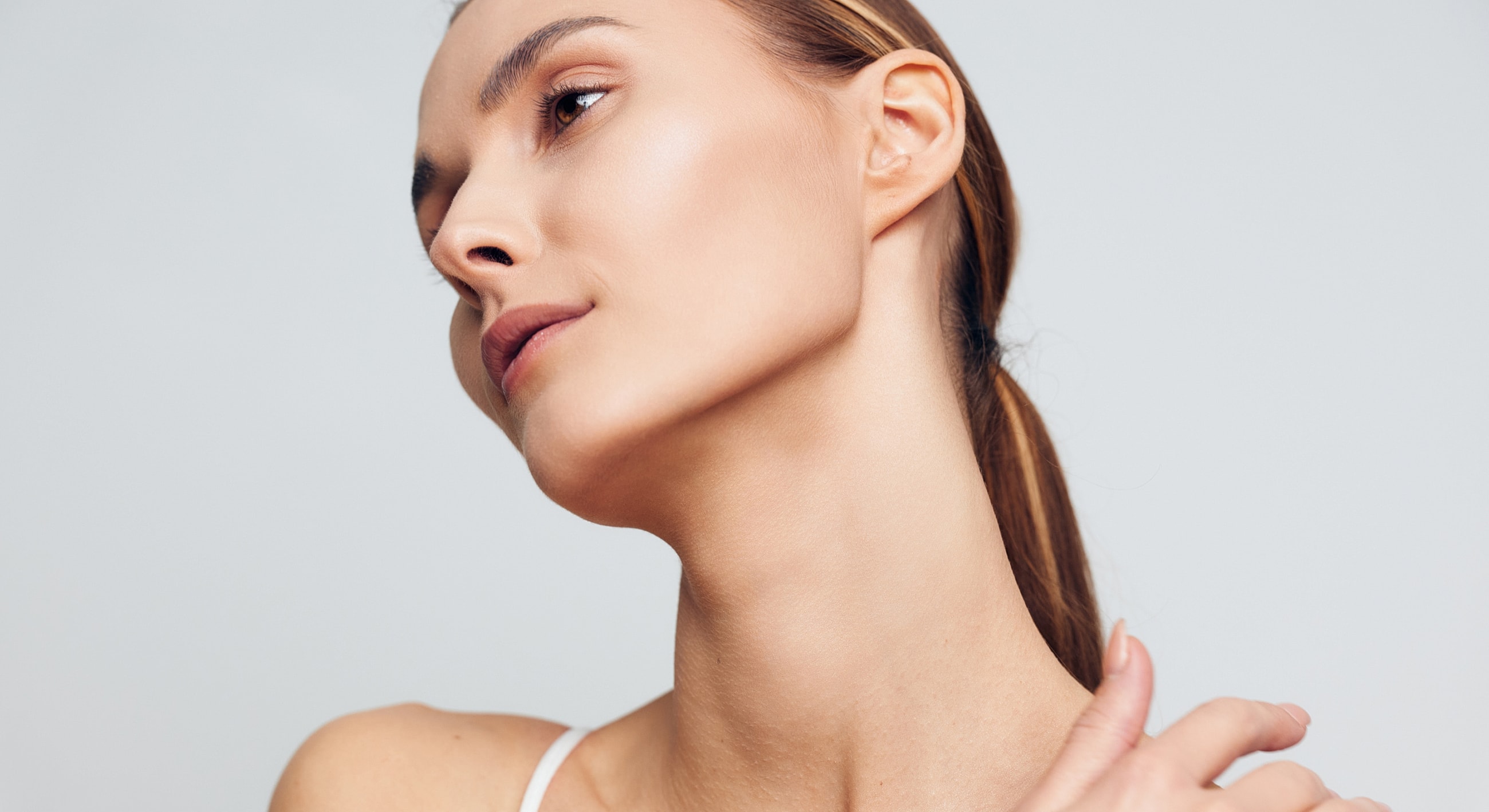 Profile of a woman with elegant neck pose.