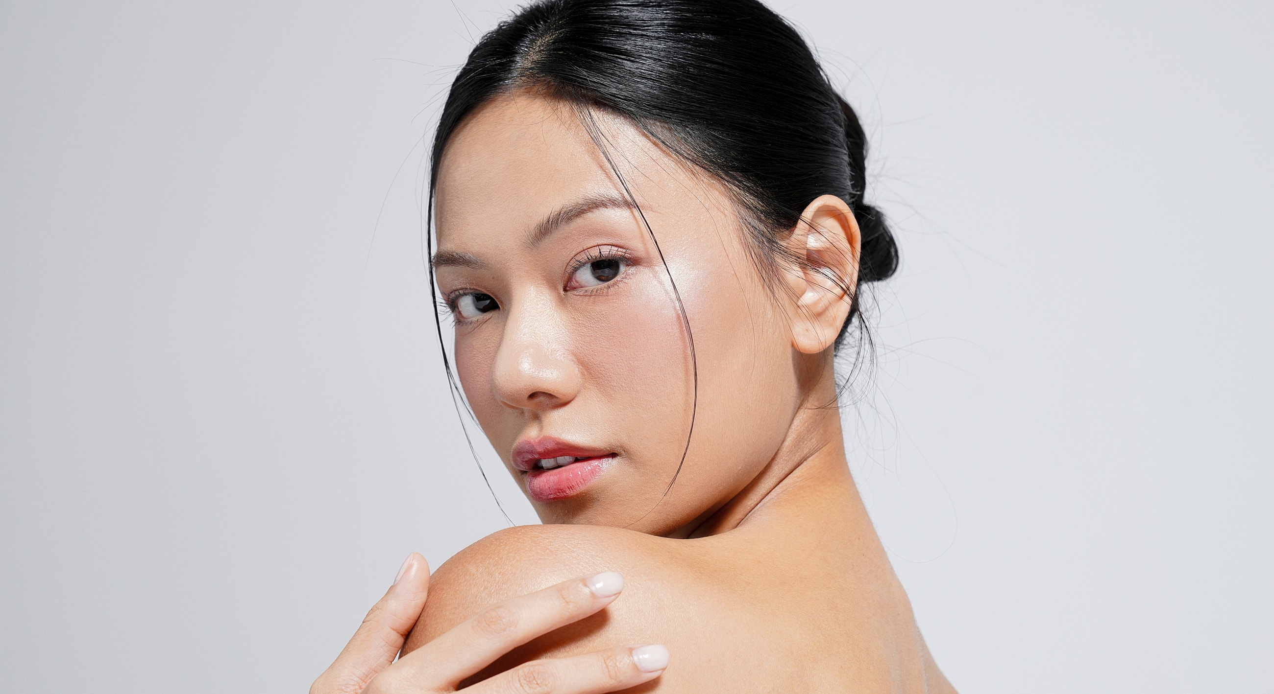Portrait of a woman with glowing skin.